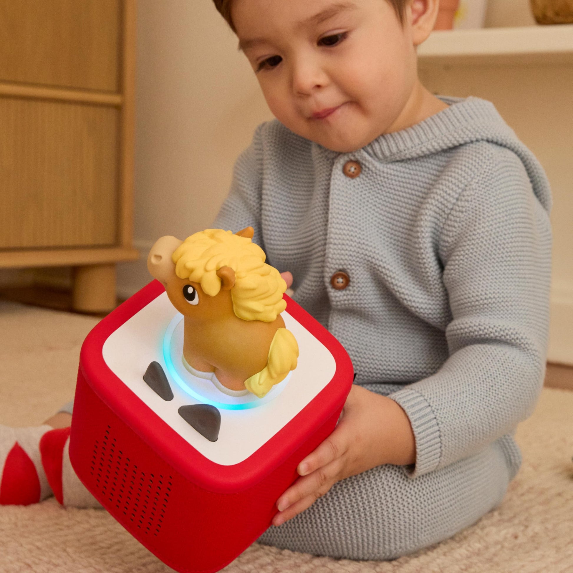 Tonies child friendly screen free audio system with squeezable cow horse and pig characters.