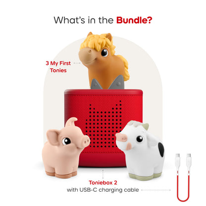 Sunset Red Toniebox 2 interactive speaker box showing the top charging pad and volume control ears.
