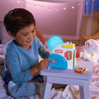 Toddler using the kid friendly buttons on the blue and white audio story toy