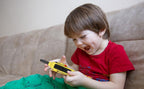 Back side view of the yellow children radio toys showing the secure belt clip.