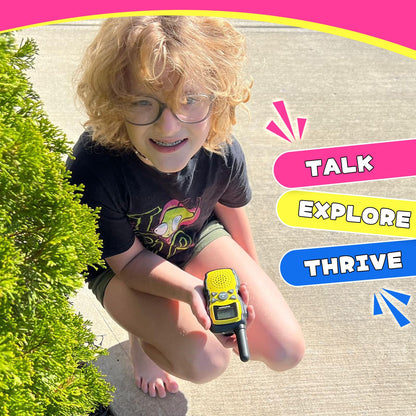 Children playing outdoors with pink and purple walkie talkies