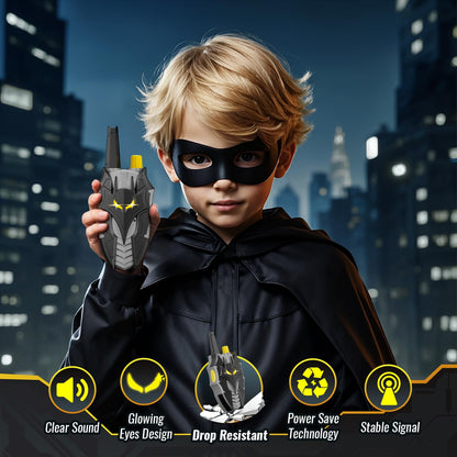 Kid using imported bat wing communication radio toy in a garden