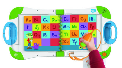 Child using the LeapFrog LeapStart stylus on the Alphabet Adventures book