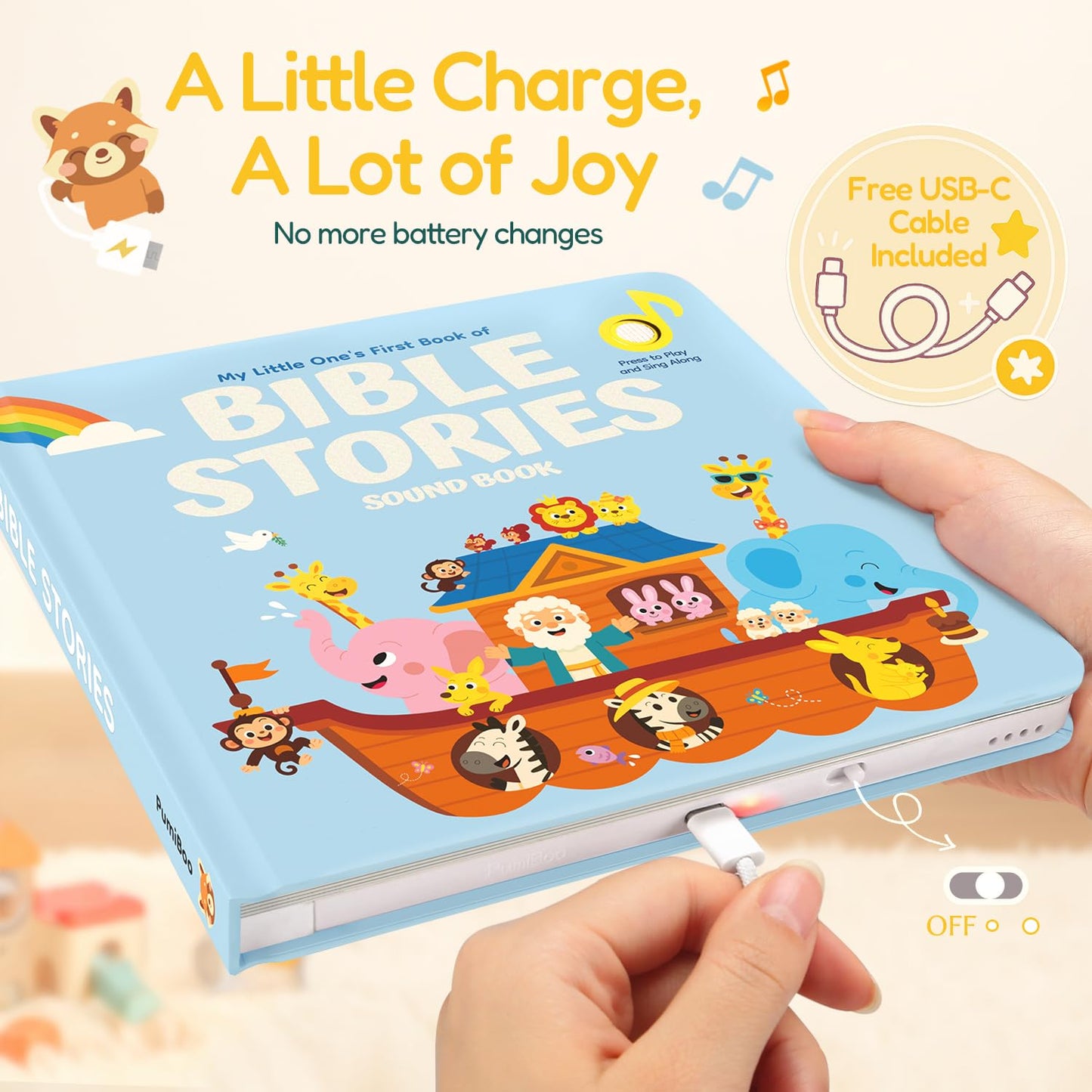 Child hands playing with Pumiboo Bible songs board book