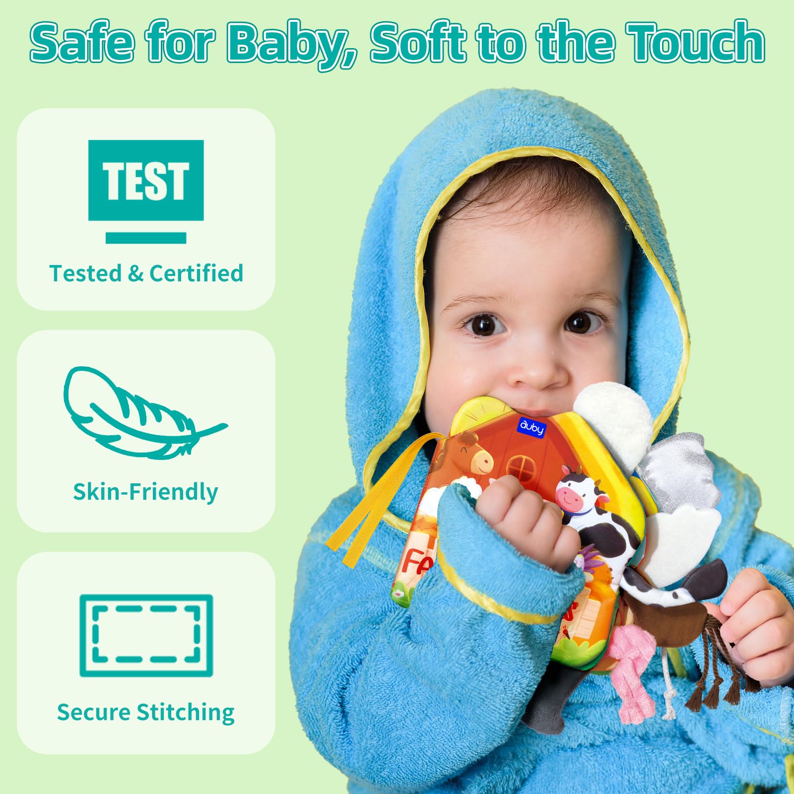 Infant playing with crinkle fabric book pages