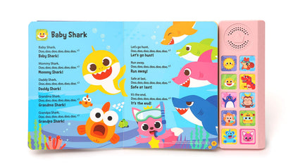 Toddler using interactive sound book during playtime