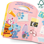 Child hands lifting a flap in the Blue's Clues interactive book