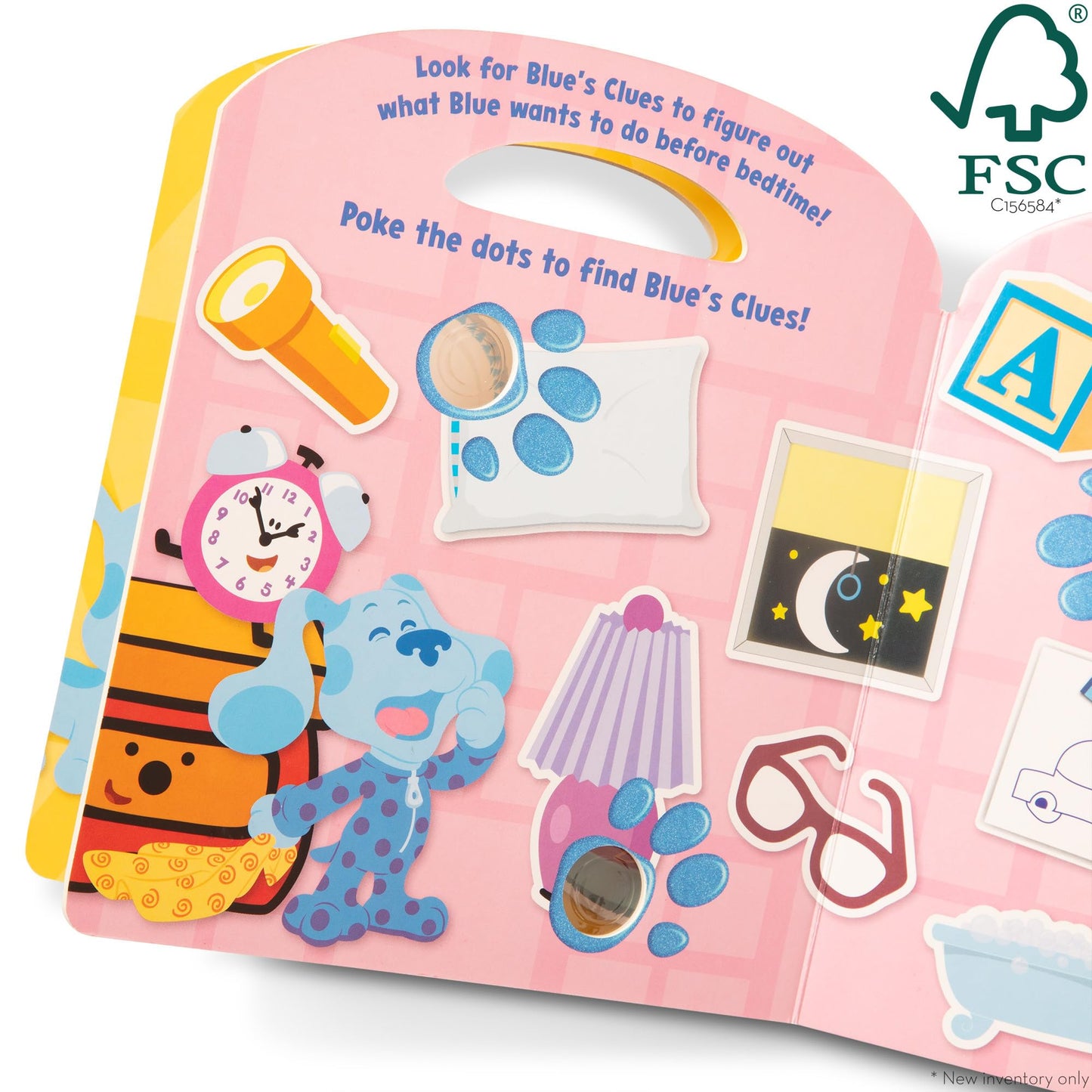 Child hands lifting a flap in the Blue's Clues interactive book