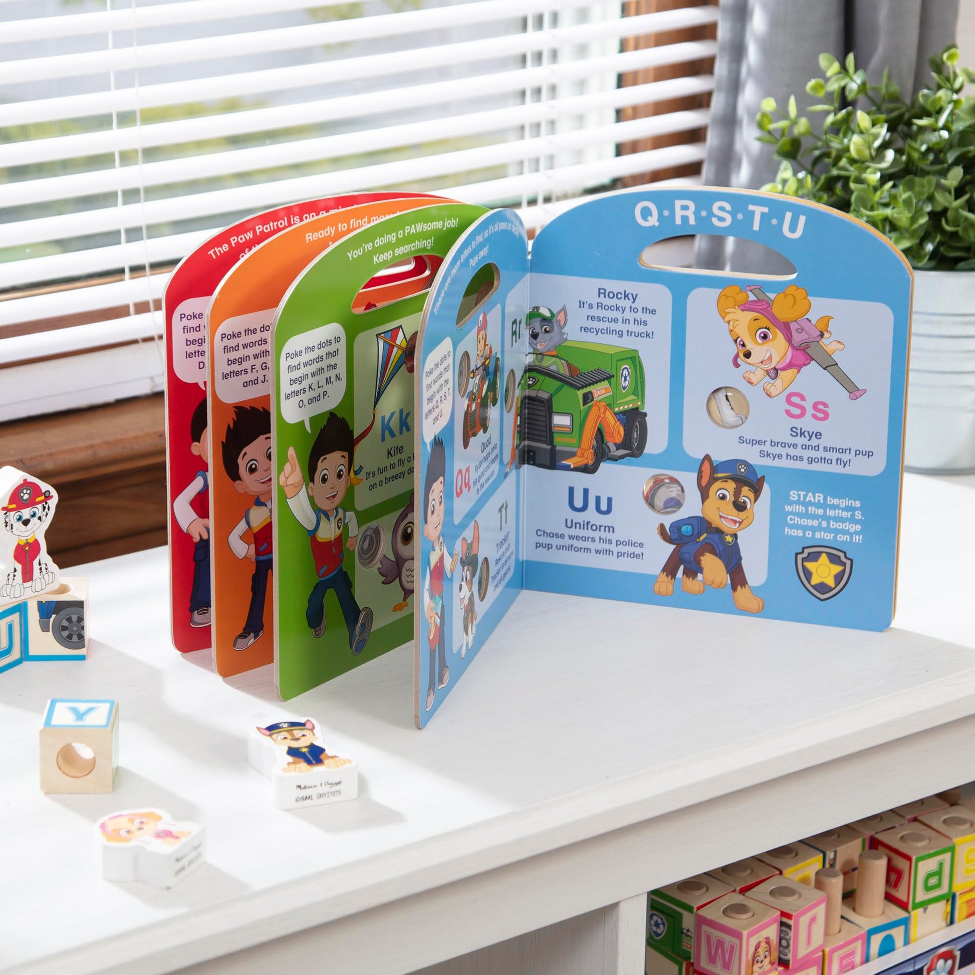 Back view of PAW Patrol alphabet book with integrated carry handle