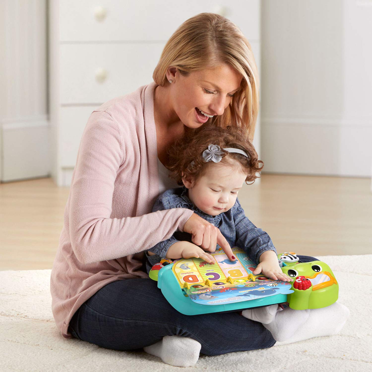 Toddler playing with VTech Touch and Teach Sea Turtle