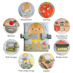 Toddler hands using the zipper activity in the Taf Toys busy book