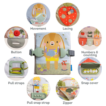 Toddler hands using the zipper activity in the Taf Toys busy book