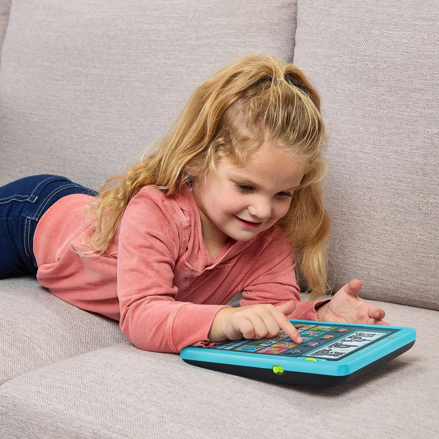 Child playing with LeapFrog Touch and Learn eReader