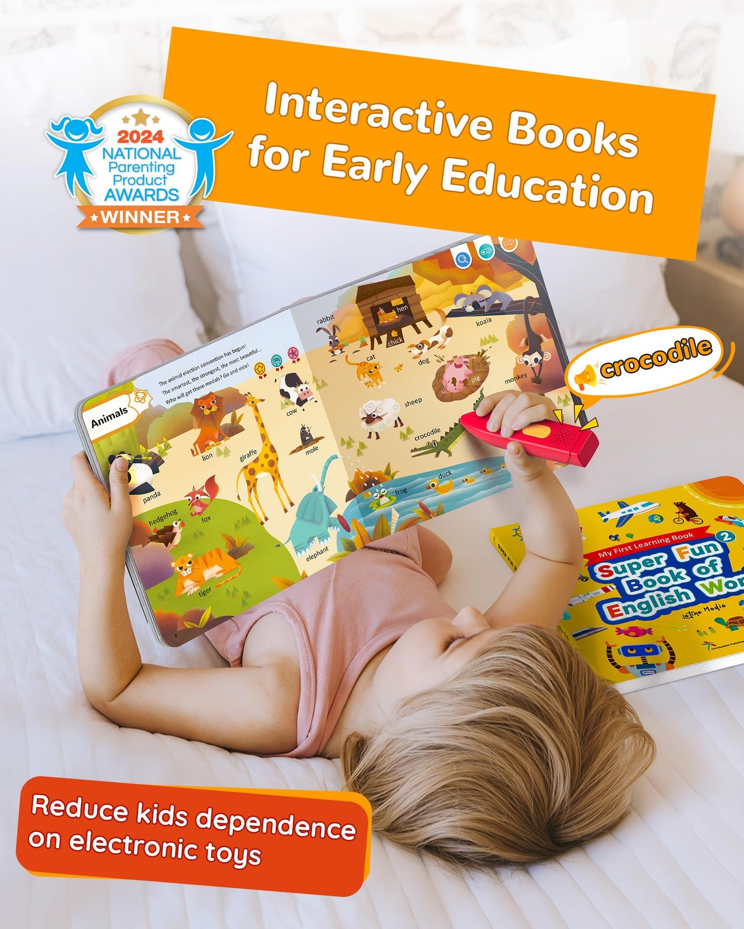 Toddler playing with Kokodi interactive audio learning books