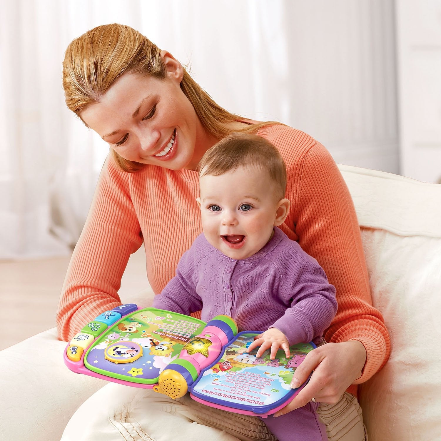 VTech Musical Rhymes Book open pages showing nursery rhyme illustrations.