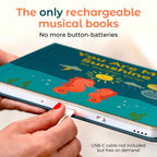 Toddler hands pressing button on Cali's Books musical nursery rhyme board book