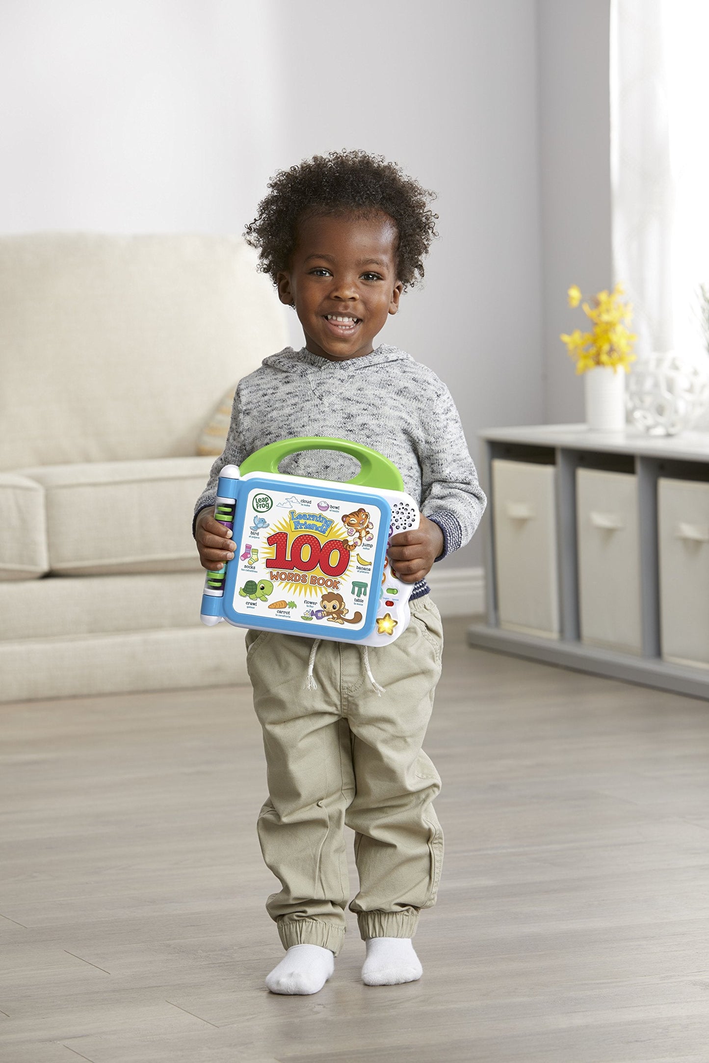 Child interacting with LeapFrog Learning Friends bilingual book
