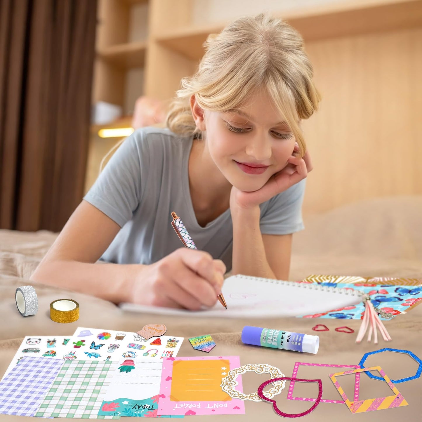 Two spiral notebooks with colorful stickers and pens