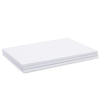 White sketchbooks bundle on a creative workspace