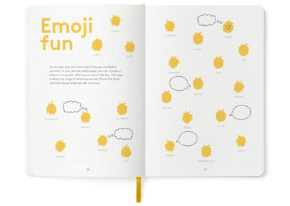 Child using The HappyMe Journal for writing and drawing