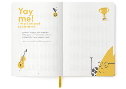 Close up of The HappyMe Journal embossed yellow cover