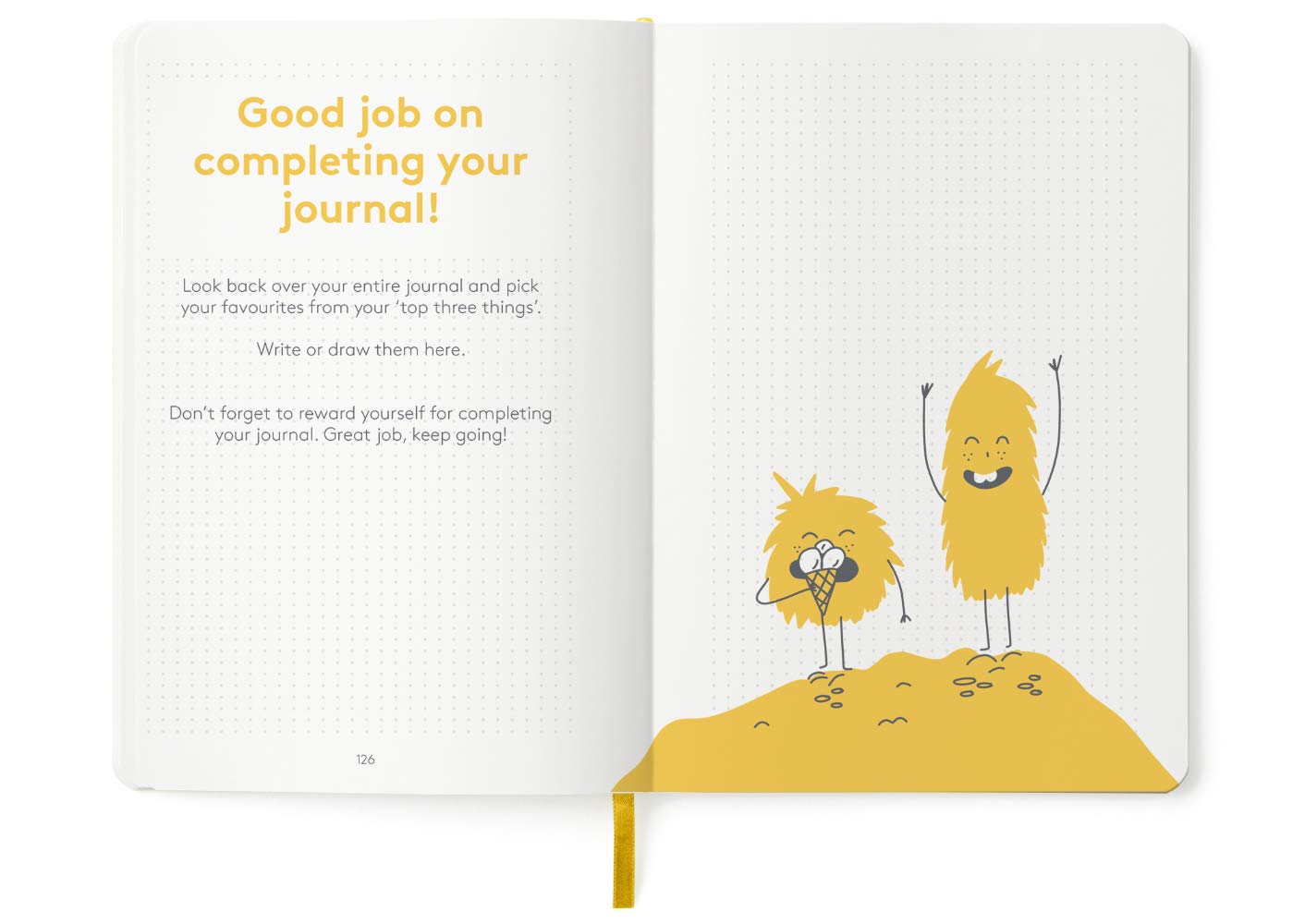 The HappyMe Journal set on a desk with stationery items