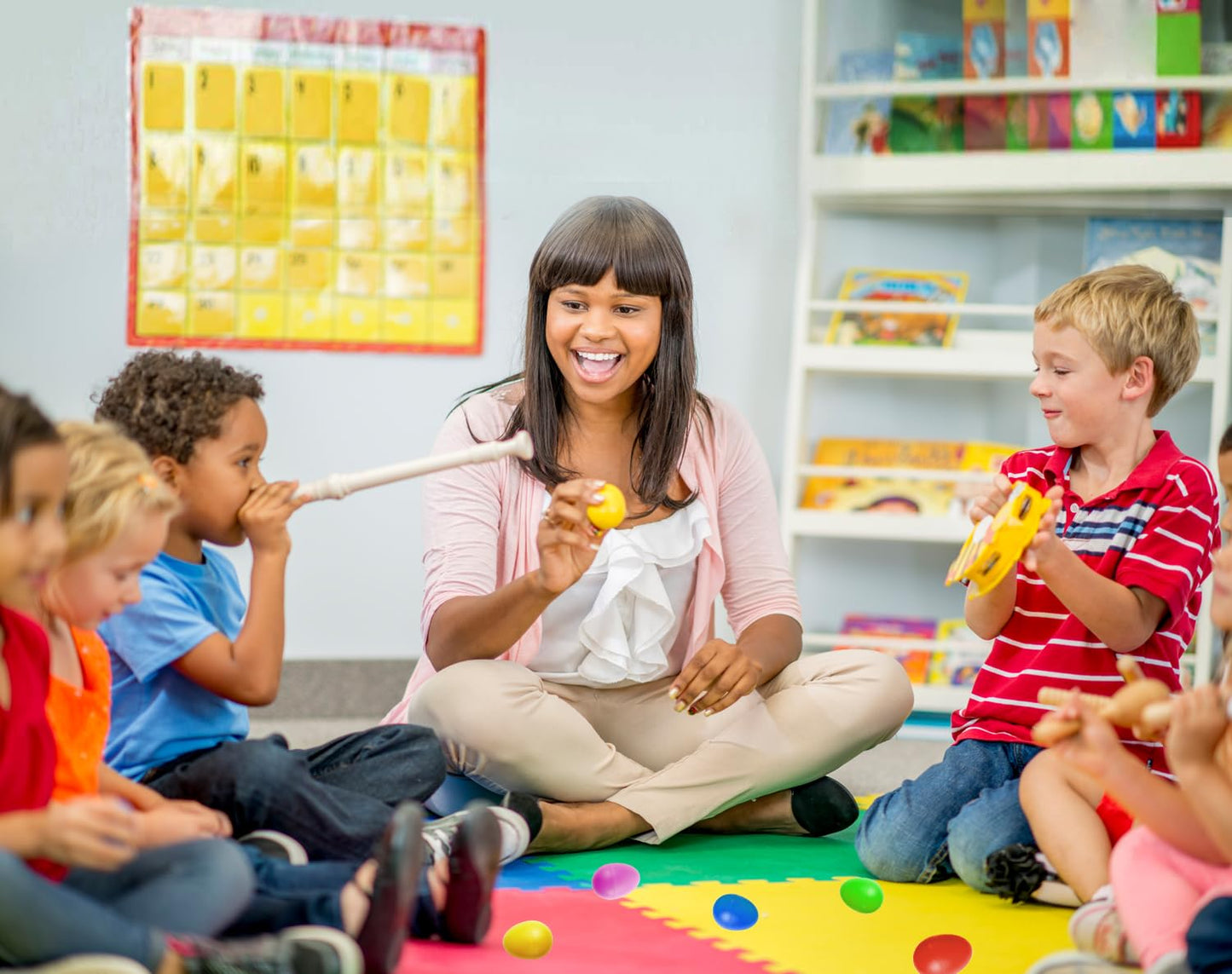 GIFTEXPRESS preschool rhythm instruments being held by a toddler to demonstrate the perfect compact size.
