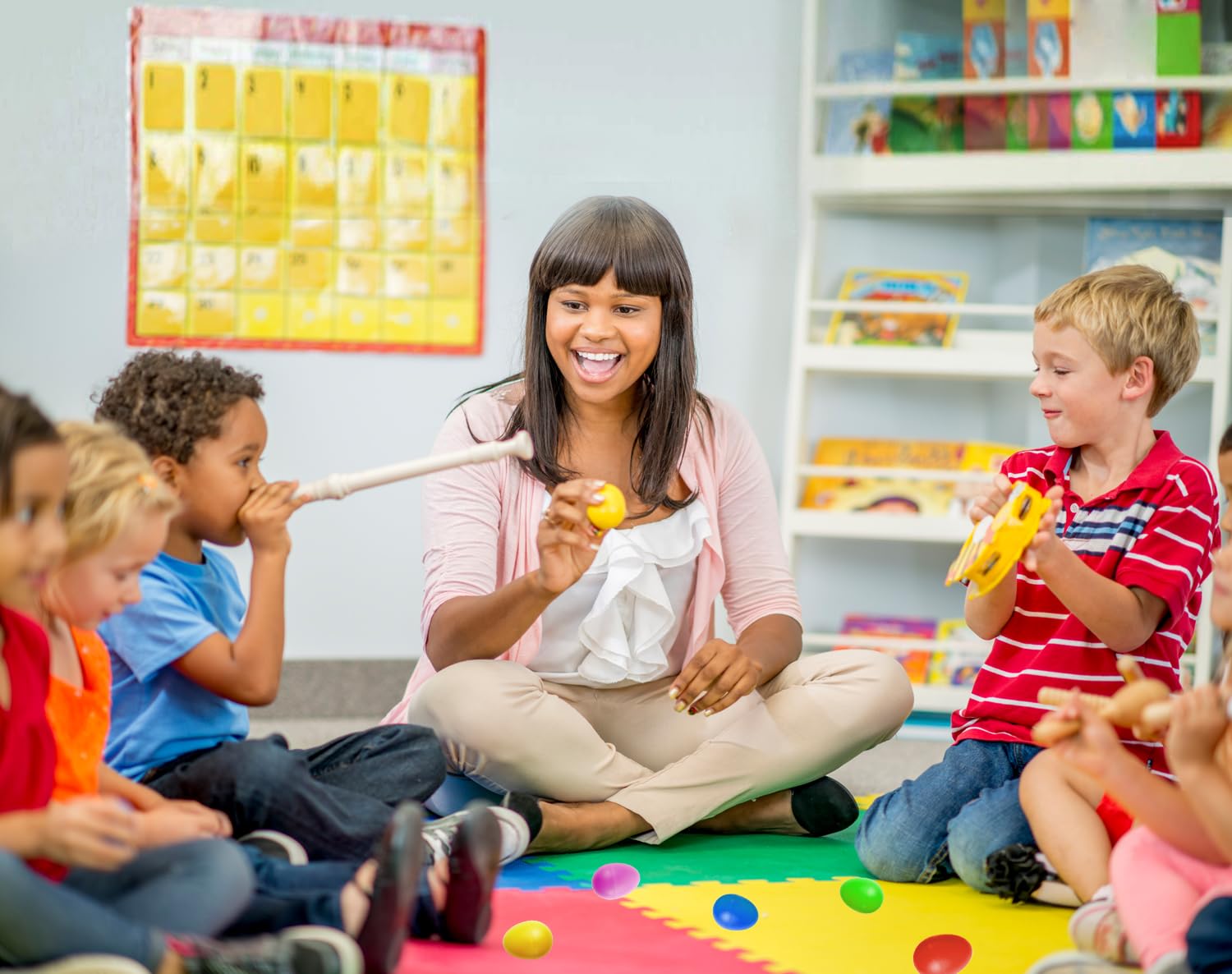 GIFTEXPRESS preschool rhythm instruments being held by a toddler to demonstrate the perfect compact size.