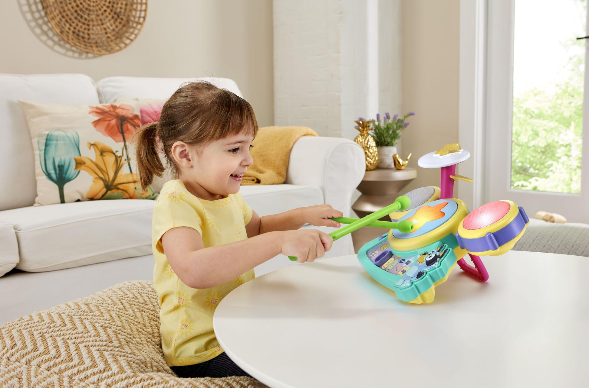 Close up view of the Bluey character button and built-in speakers on the learning toy