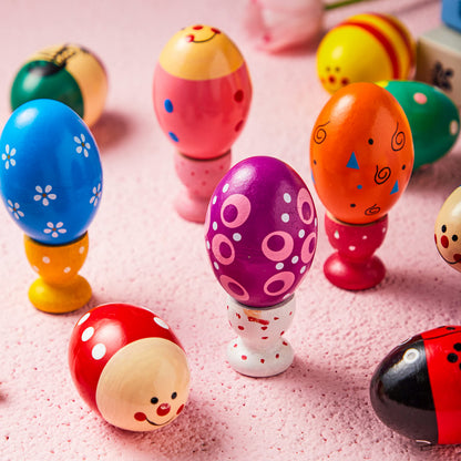 Child holding two vibrant JOYIN wooden egg instruments preparing to shake them for rhythm.