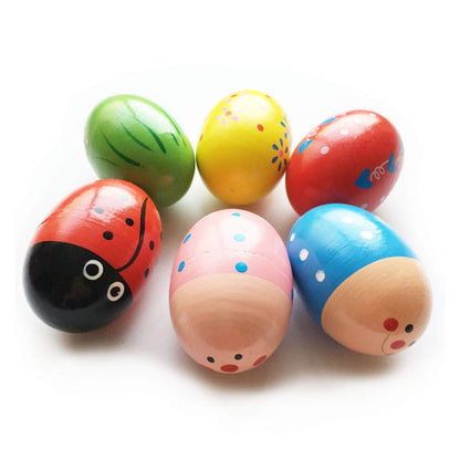 JoFAN musical egg shakers held by a toddler demonstrating the perfect size for small children