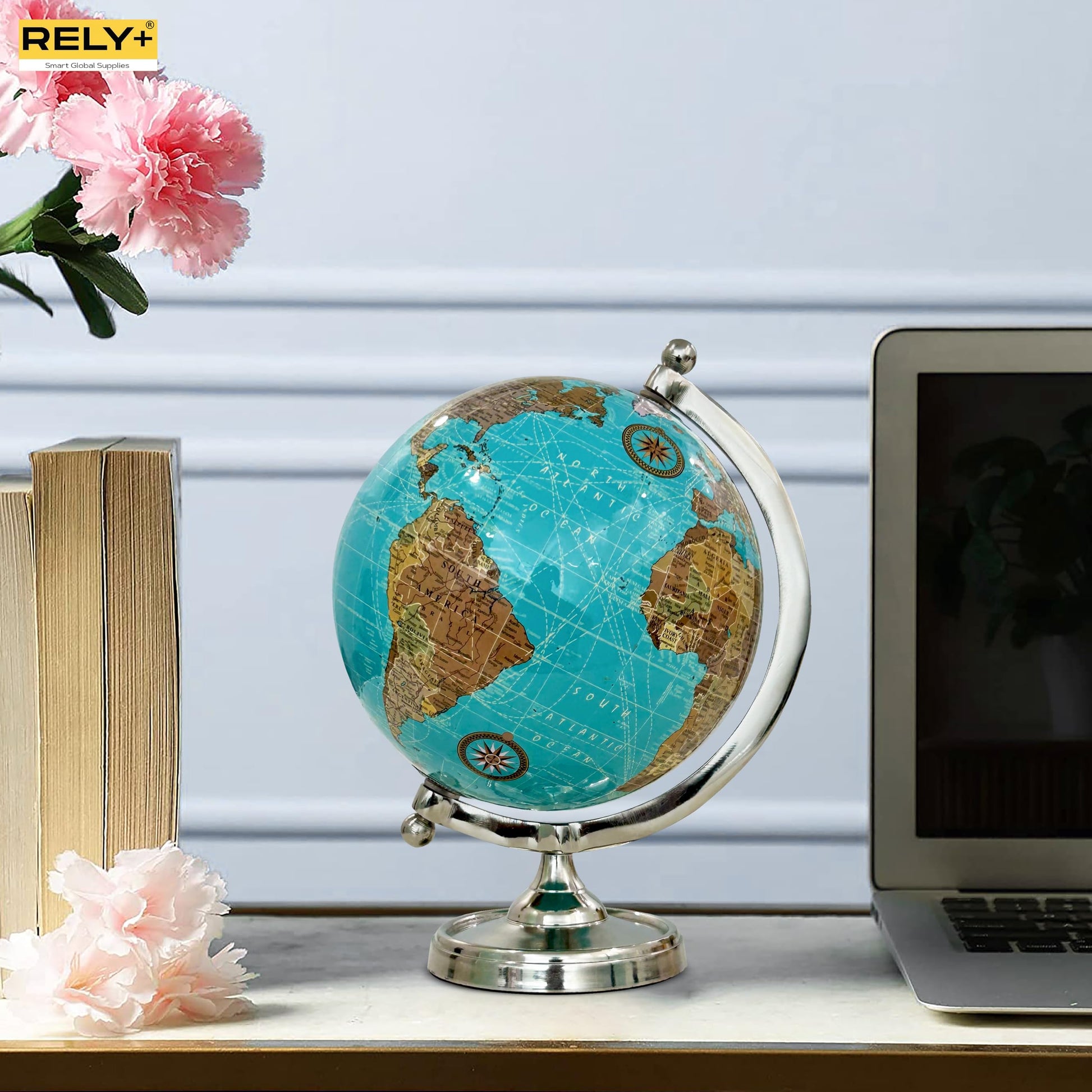Rely+ globe styled on a wooden study desk