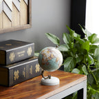 Close up of decorative world map globe on marble stand