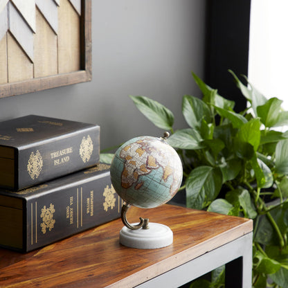 Close up of decorative world map globe on marble stand