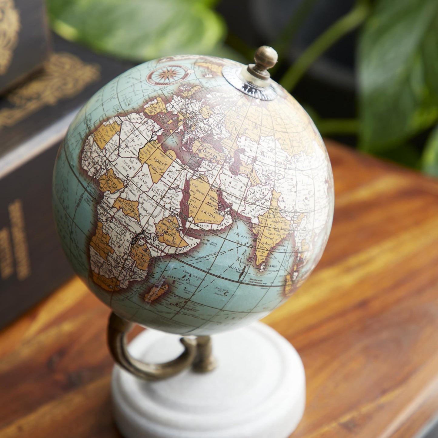 Side angle of Deco 79 teal marble decorative globe