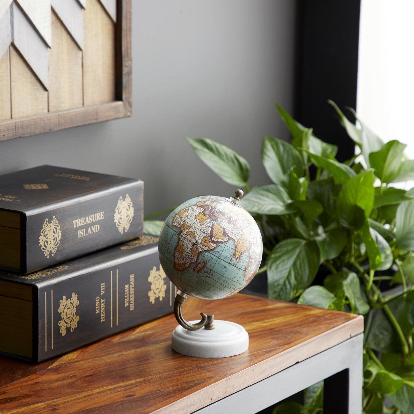 Detailed brass stand and marble base of desk globe