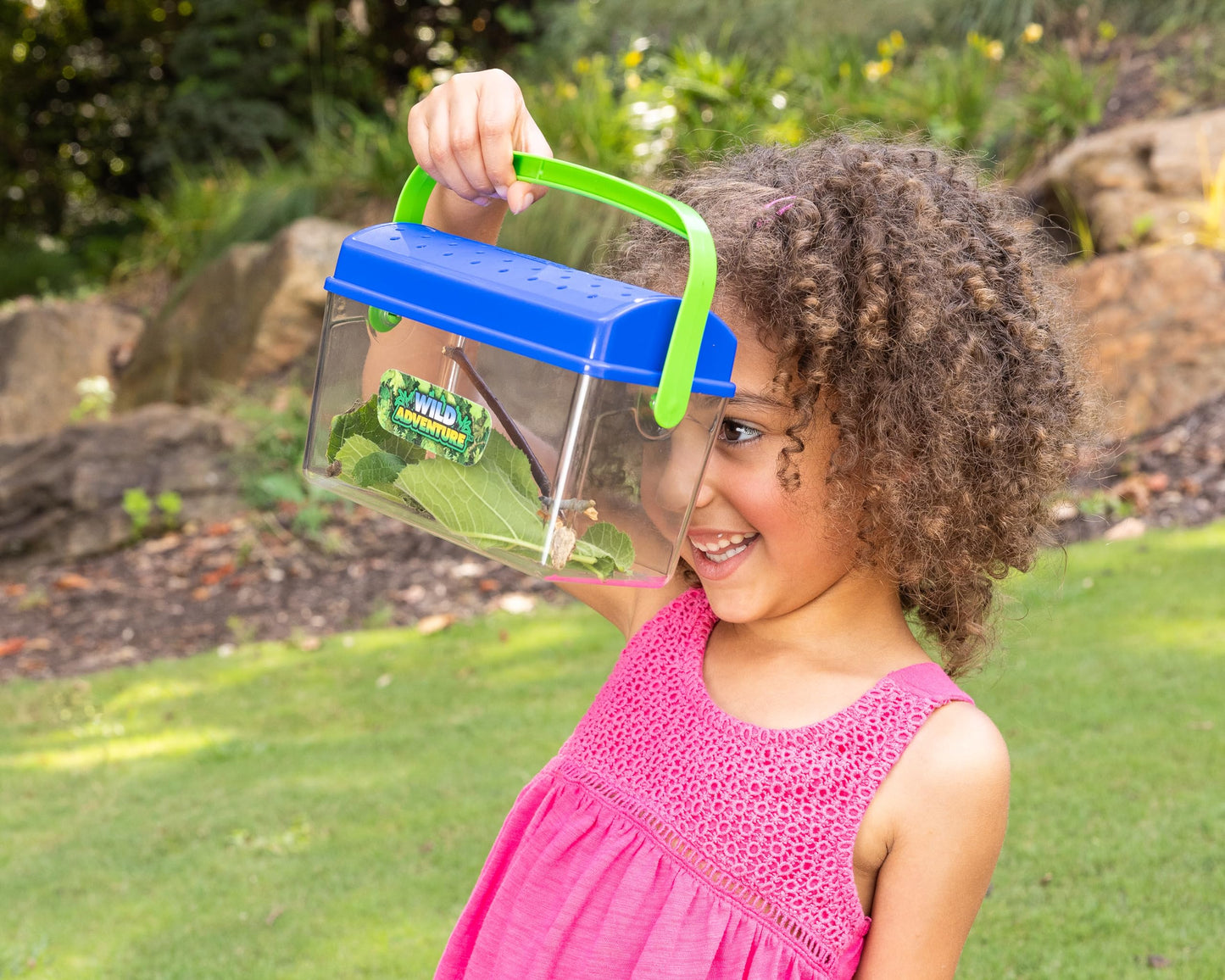 Side angle of the Sunny Days critter shack showing decorative butterfly decals on the transparent container