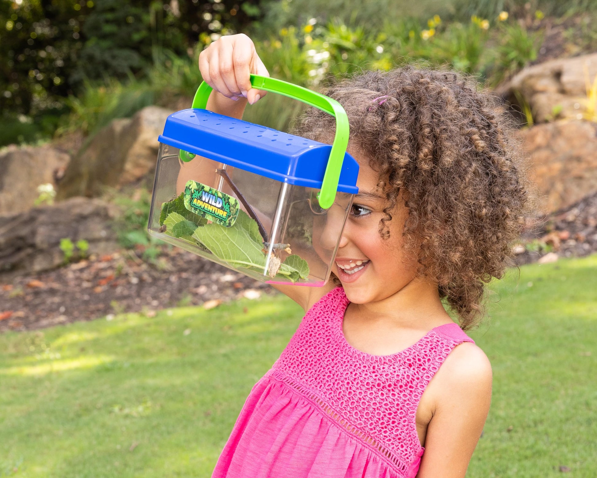 Side angle of the Sunny Days critter shack showing decorative butterfly decals on the transparent container