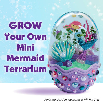 Assembled egg-shaped mermaid terrarium with sprouted green chia seeds and colorful sand layers