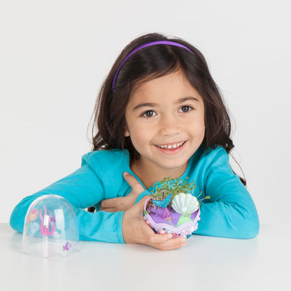 Finished mermaid terrarium mini garden standing next to a standard ruler displaying its dimensions