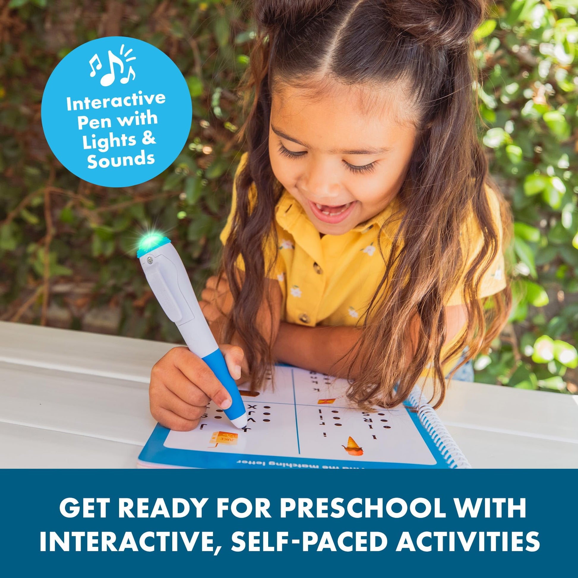 Close up of the spiral bound preschool prep workbook showing letter recognition and phonics exercises
