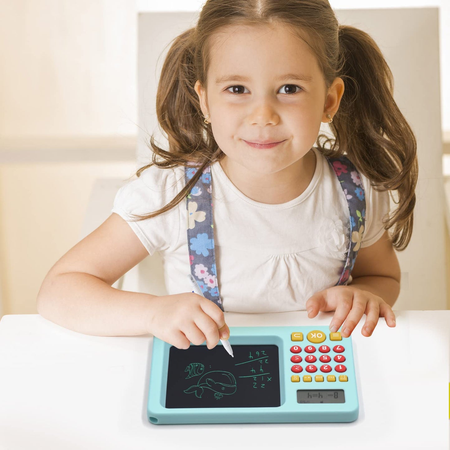 Mannequin kids learning tablet box packaging including the blue educational device and USB cable.