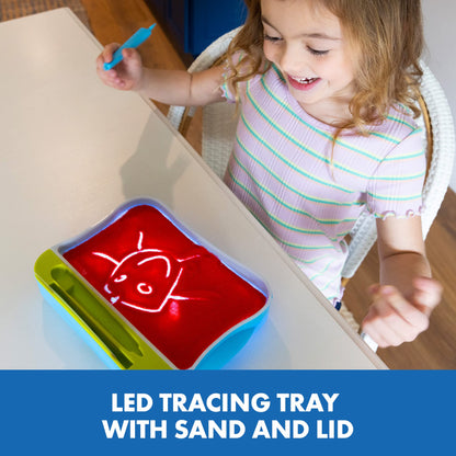 Toddler learning alphabet activities using the dual-tip stylus to write letters in red sand
