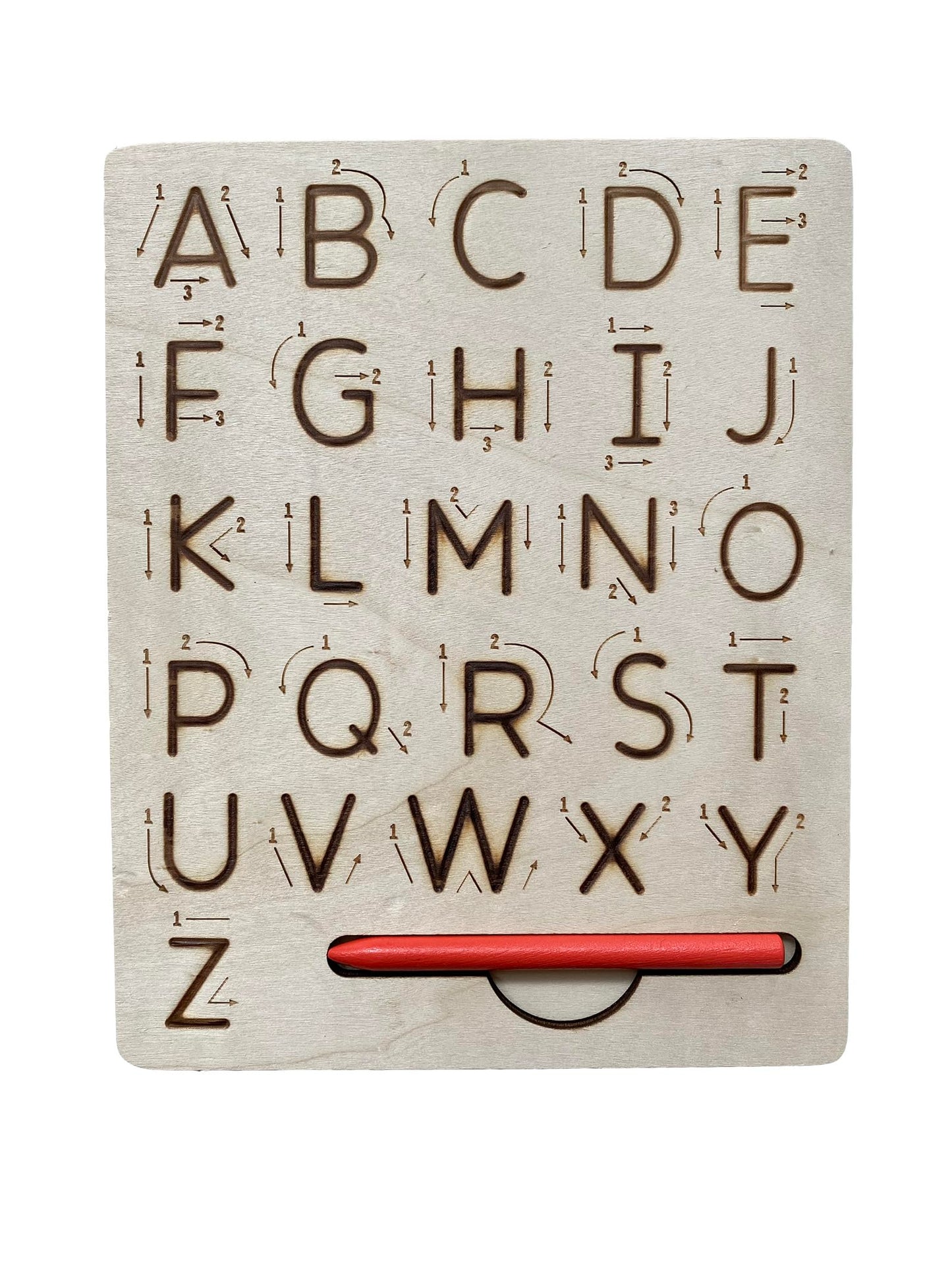 Toddler practicing pencil grip and alphabet formation using the wooden stylus on the grooved board
