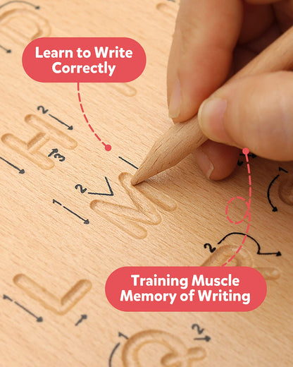 Preschool child using the wooden stylus to trace letters on the Coogam Montessori board