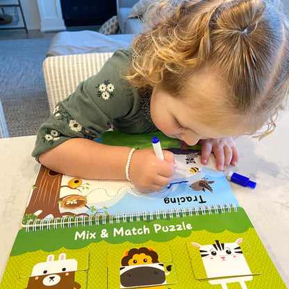 Toddler hands interacting with the premium pre assembled preschool workbook for fine motor practice.