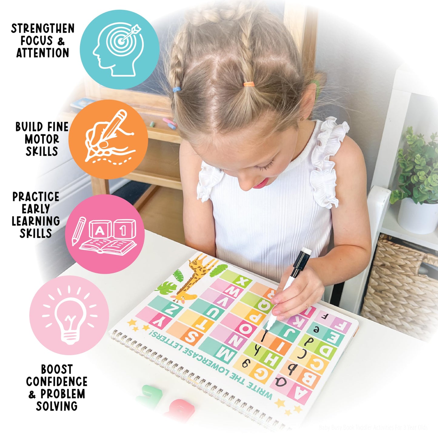 Hadley Designs reusable alphabet tracing book demonstrating the easy wipe-clean action with the provided eraser.