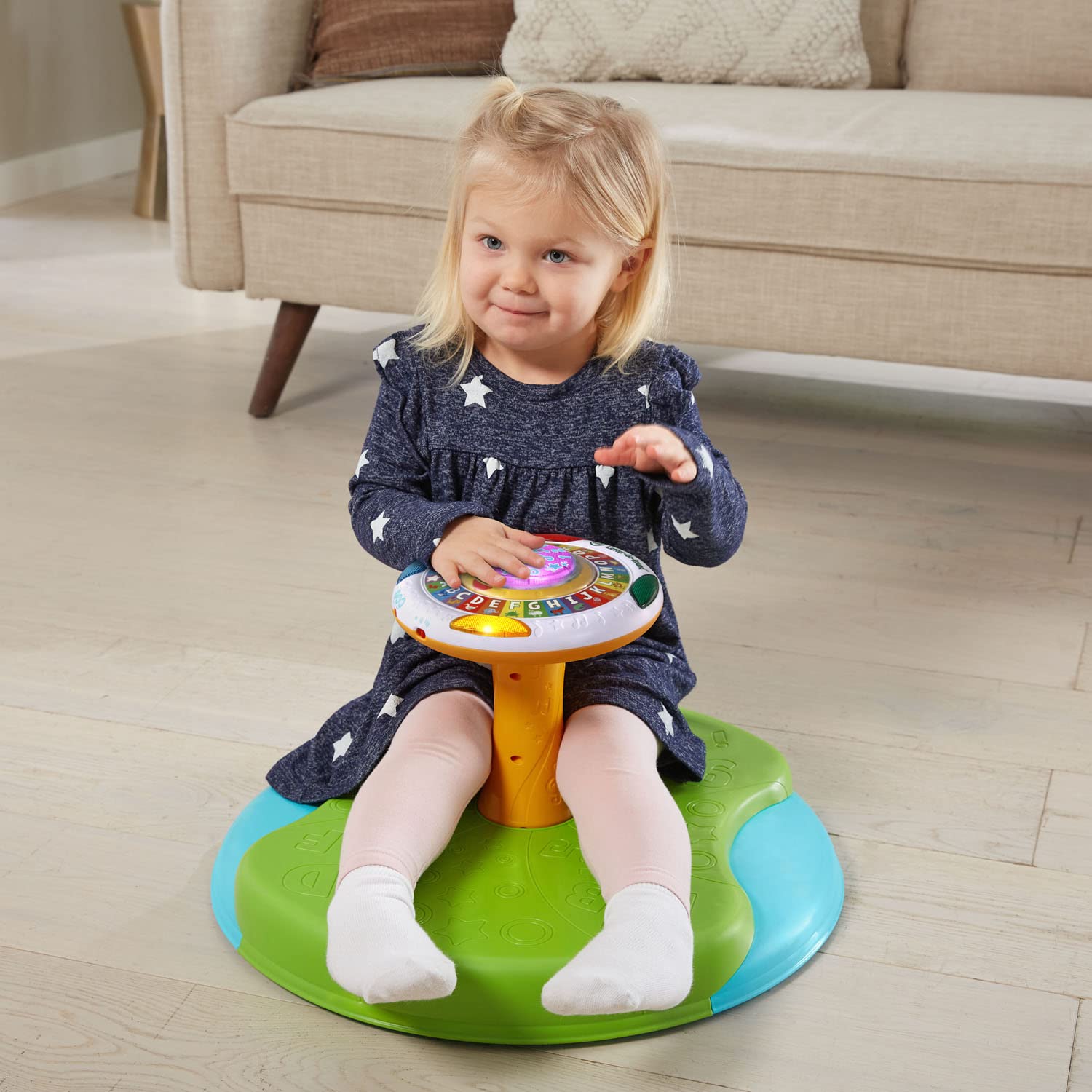 Side view of LeapFrog Letter-Go-Round showing durable plastic seating area