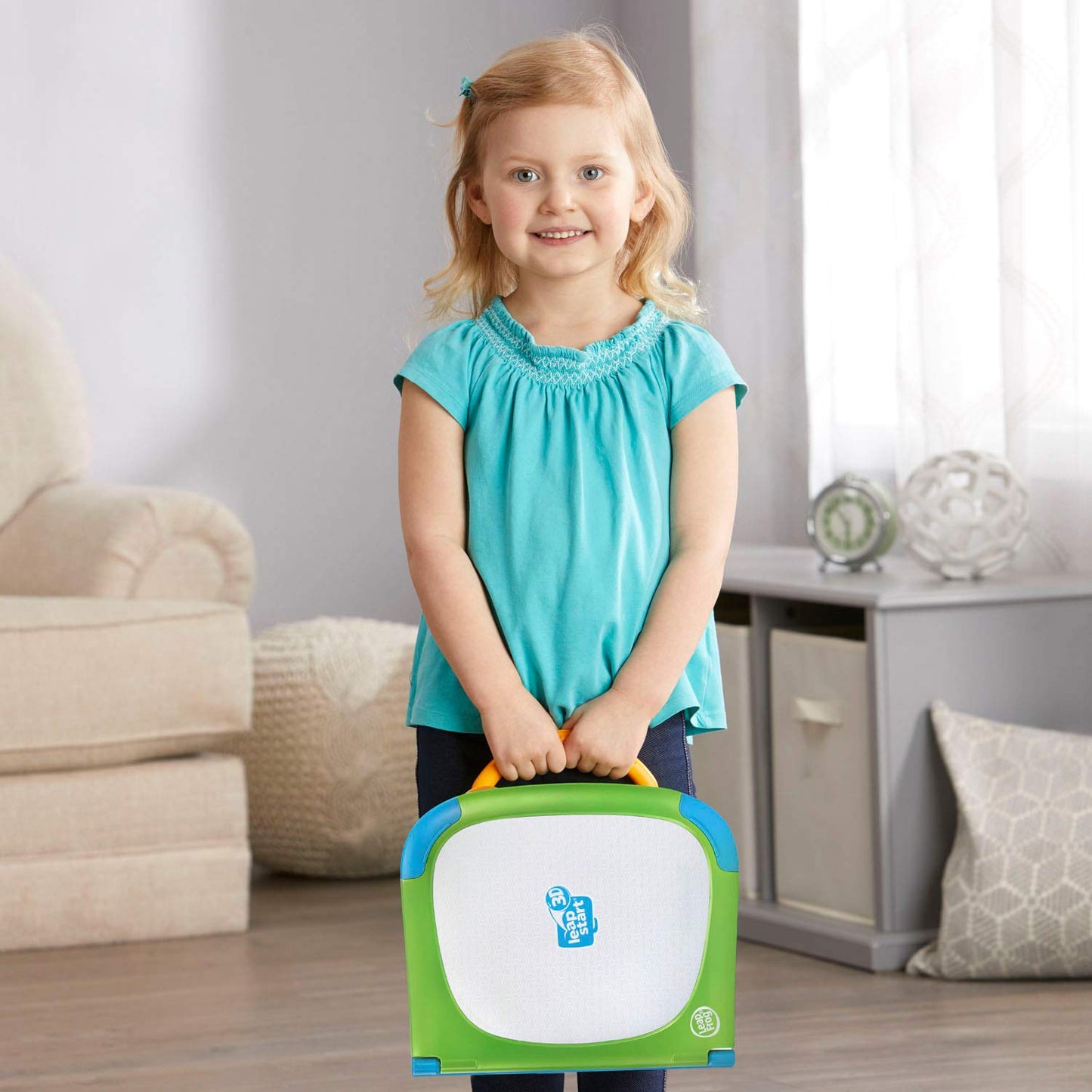 LeapFrog interactive book platform showing battery compartment and stylus cord connection.