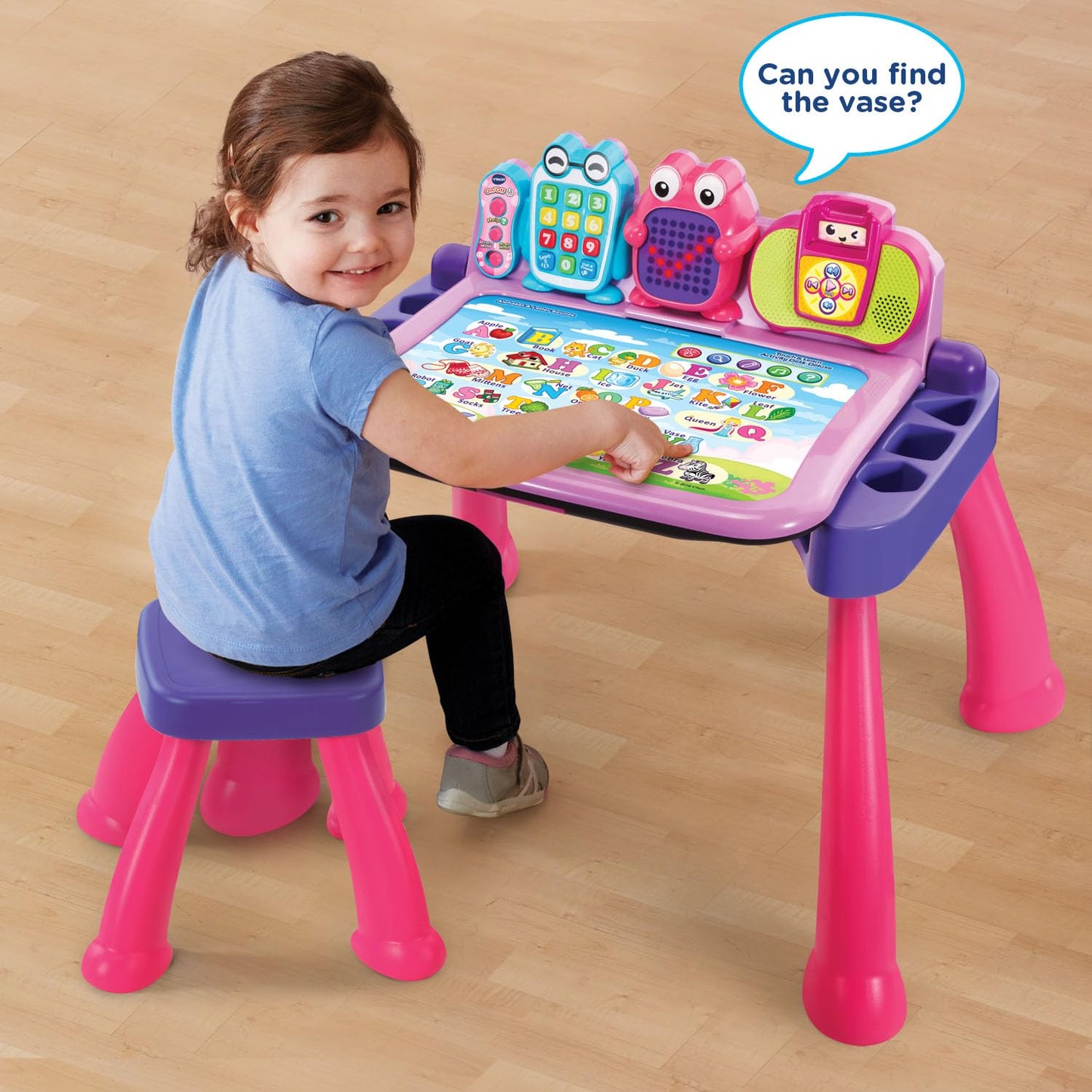 VTech Touch and Learn Activity Desk Pink displaying interchangeable interactive learning pages